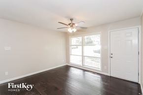 Kennesaw house for rent - a living room with wood floors and a ceiling fan