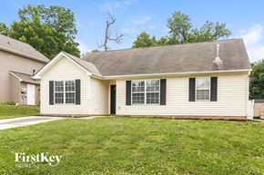 Charlotte house for rent - a white house with black shutters and a lawn