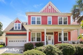 Summerville house for rent - a red house with white trim and a black roof