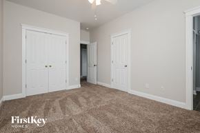 Summerville house for rent - a bedroom with two closets and a carpeted floor