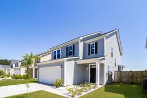 Summerville house for rent - A two-story house with a garage and a fence.