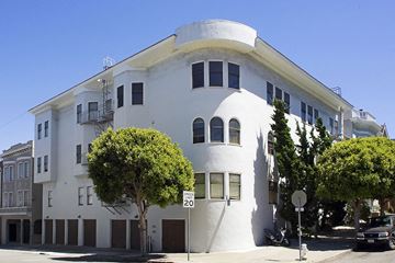 San Francisco apartment for rent - A white building with a round section on the top floor.