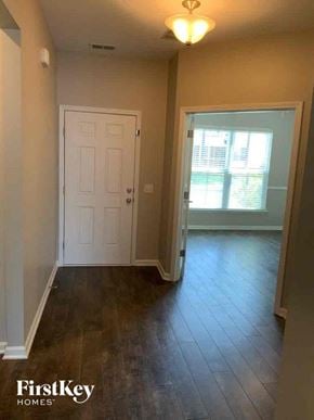 Moncks Corner house for rent - A room with a white door and a window with blinds.