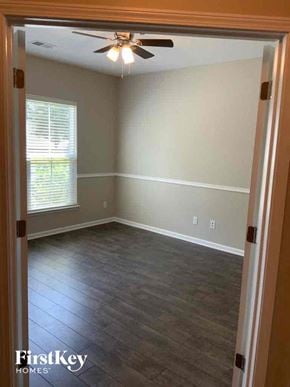 Moncks Corner house for rent - A room with a ceiling fan and wooden flooring.