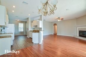 Winter Haven house for rent - an open kitchen and living room with wood flooring