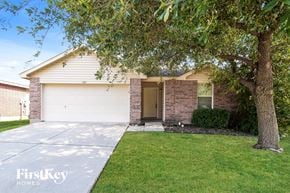Haslet house for rent - A house with a tree in front of it.