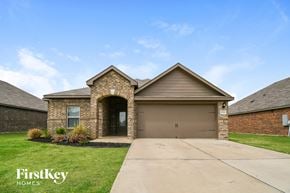 Crowley house for rent - a house with a driveway and a garage door