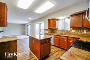 Columbus house for rent - full view of kitchen with wooden cabinets and counter tops and a sink