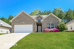 Mount Olive house for rent - a brick house with a lawn and a white garage door