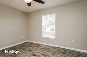 Winter Haven house for rent - a bedroom with a window and a ceiling fan