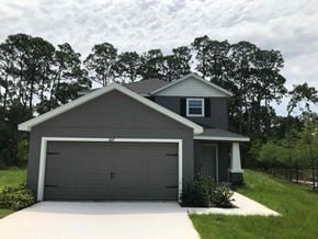 Bradenton house for rent - A two-car garage is attached to a house.