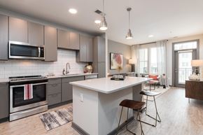 Durham apartment for rent - a kitchen and living room with a white counter top