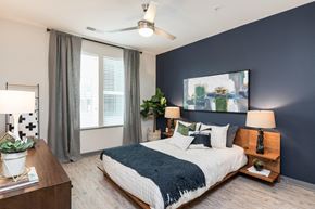 Durham apartment for rent - a bedroom with a bed and a large window