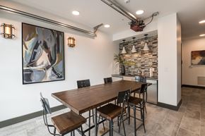 Durham apartment for rent - a dining room with a long wooden table and chairs
