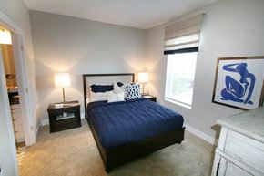 Rocky River apartment for rent - A bedroom with a bed, nightstands, and a painting on the wall.