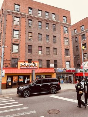 Bronx apartment for rent - a car parked on the street in front of a building