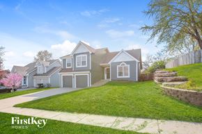 Kansas City house for rent - the front of a house with a lawn and a driveway