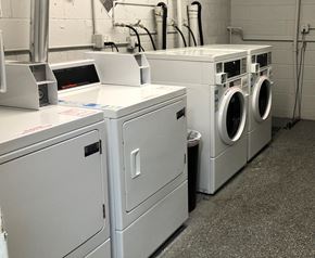 Los Alamitos apartment for rent - a row of washers and washing machines in a laundromat