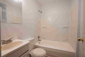 Gambrills apartment for rent - A bathroom with a toilet, sink, and bathtub.