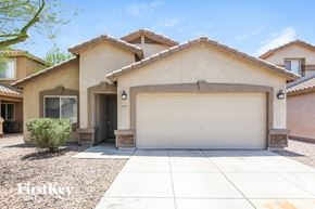 Youngtown house for rent - A house with a garage door that says "HOW" on it.