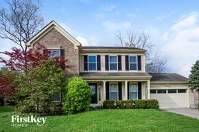 West Chester house for rent - A house with a tree in front of it.