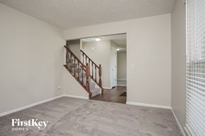West Chester house for rent - A spacious room with a staircase leading to the second floor.