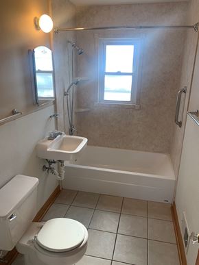 Fremont house for rent - A white toilet is in a bathroom with a window.