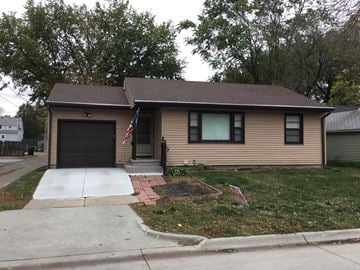 Fremont house for rent - A house with a flag on the front porch.