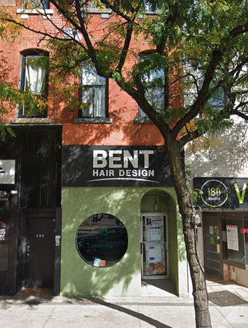Hamilton apartment for rent - a building with a sign for a hair salon