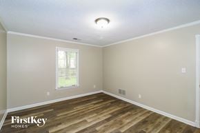Collierville house for rent - the spacious dining room with hardwood flooring and a window