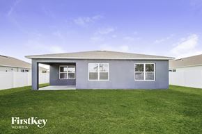 Saint Cloud house for rent - the exterior of a home with a lawn and a blue sky