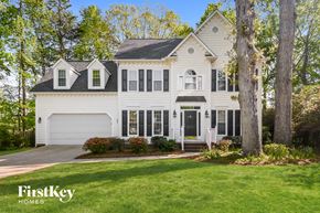 Greensboro house for rent - a white house with black shutters and a lawn