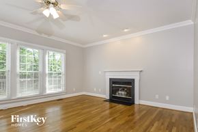 Greensboro house for rent - a living room with a fireplace and a wooden floor
