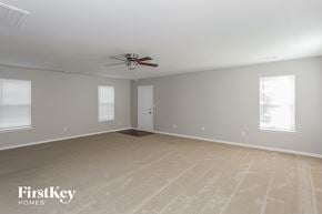Charlotte house for rent - the living room of a home with a ceiling fan