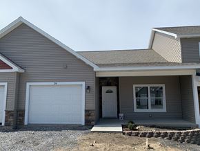 Penn Yan apartment for rent - a gray house with a white garage door