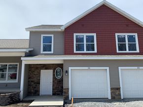 Penn Yan apartment for rent - a house with two garage doors and a driveway