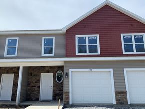Penn Yan apartment for rent - the front of a house with two garage doors