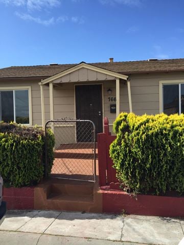 Salinas apartment for rent - A house with a brown door and a mailbox number 1666.