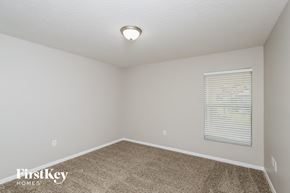 Palm Bay house for rent - the spacious bedroom has carpeted floors and a large window