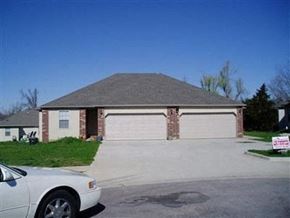 Springfield house for rent - A white car is parked in front of a garage.