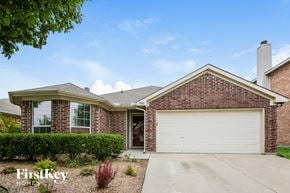 Fort Worth house for rent - a home with a white garage door in front of it
