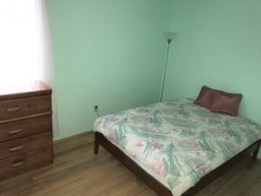 Bradenton house for rent - a bedroom with a bed and a dresser