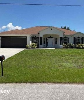 Cape Coral house for rent - A house with a brown roof and a white door.