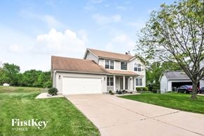 Saint Peters house for rent - a white house with a garage and a driveway