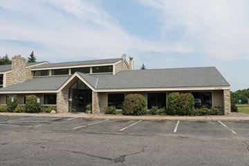 Elk River apartment for rent - the front of a building with a empty parking lot
