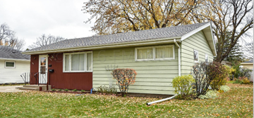 Fargo house for rent - a small yellow house with a red door