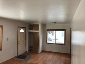 Grand Forks house for rent - an empty living room with a window and a door
