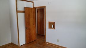Grand Forks house for rent - an empty room with a door and a mirror on the wall