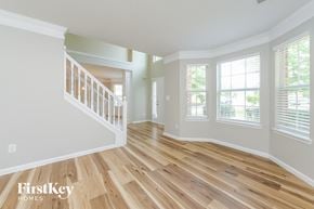 Mcdonough house for rent - an empty living room with a hard wood floor and a staircase