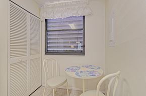 Bradenton house for rent - a dining room with a table and chairs and a window